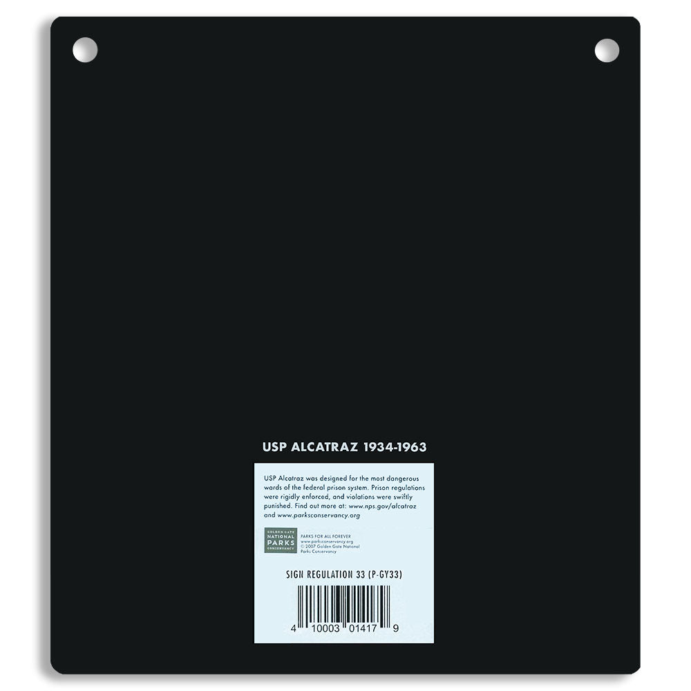 Black metal sign with 'USP Alcatraz 1934-1963' text on a white background