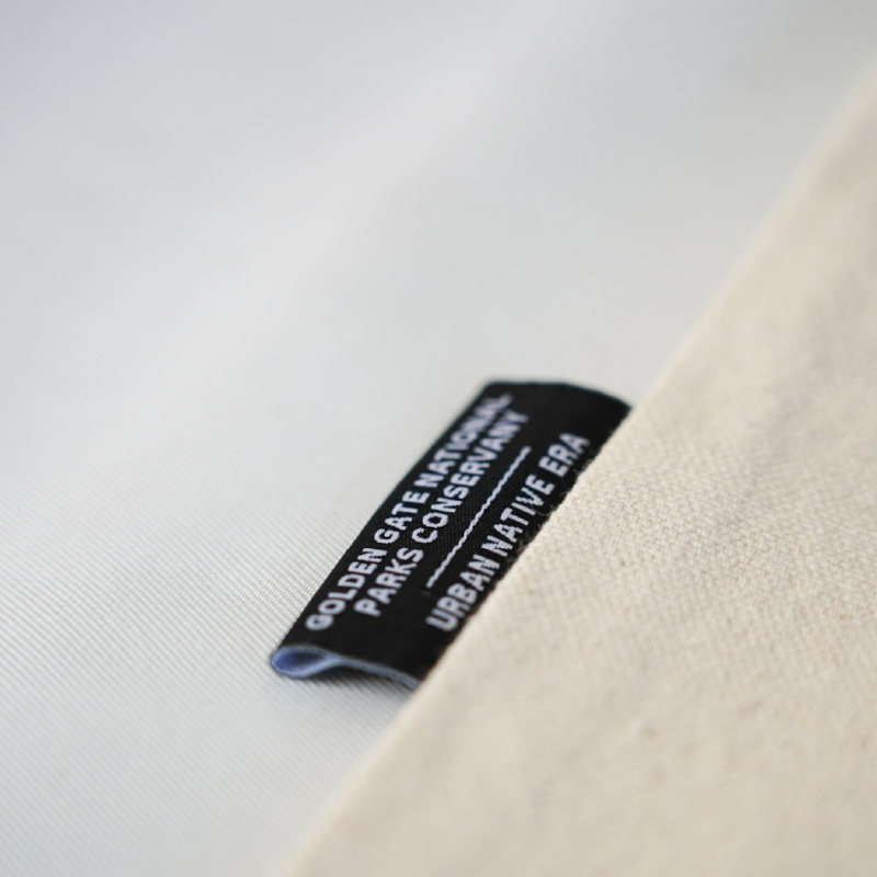 Label on a beige fabric with text