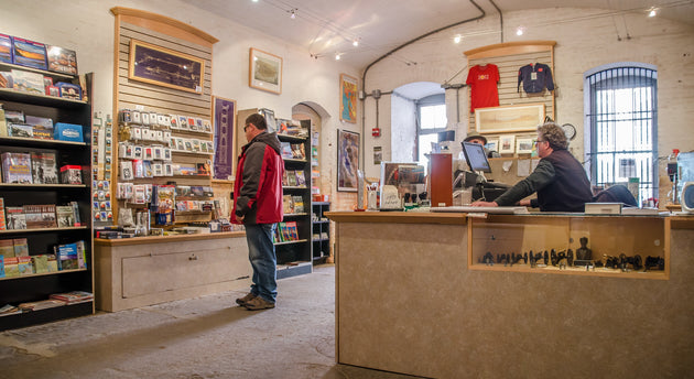 Customer shops national park inspired gifts at the Fort Point Sutlers' Store in San Francisco California