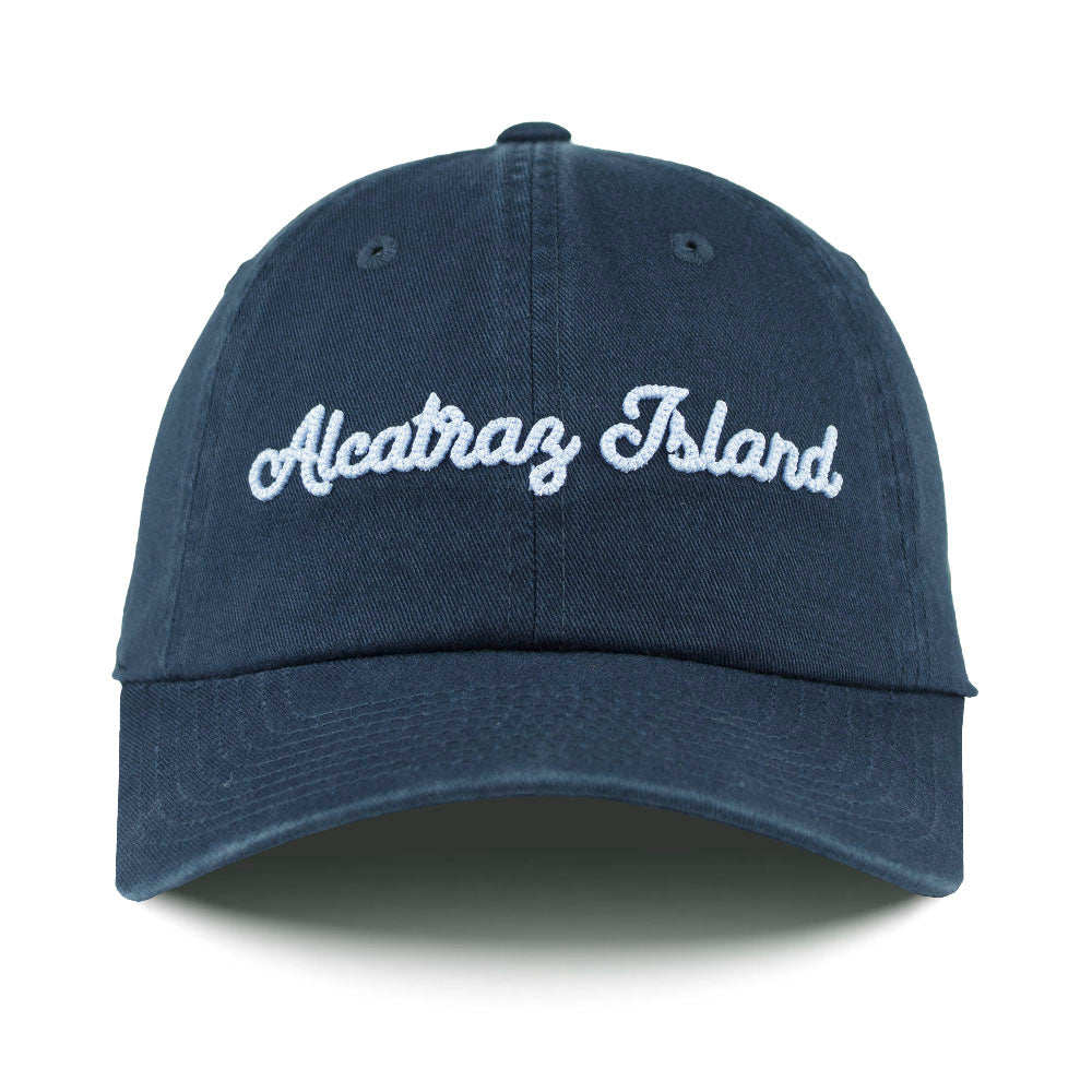 Navy blue cap with 'Alcatraz Island' text on a white background