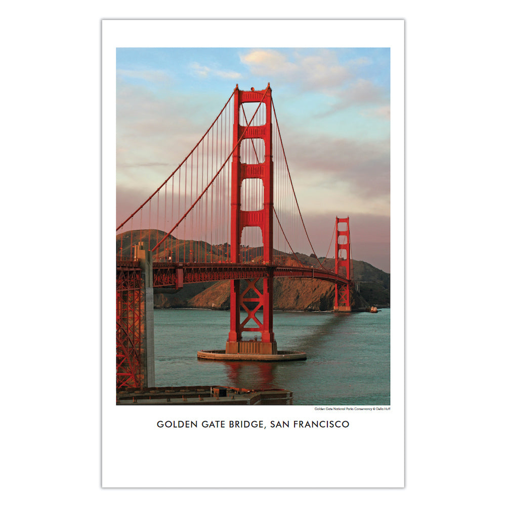 A view of the Golden Gate Bridge in late afternoon, with fog over the Marin Headlands in the background.